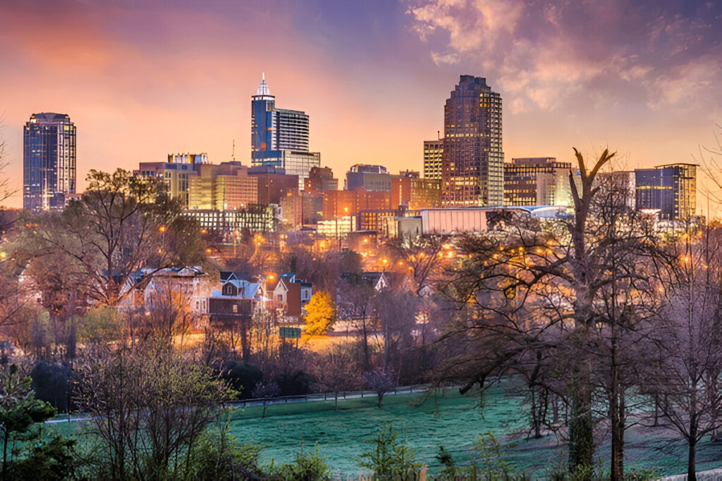 10 Of the Best East Coast Family Vacations and Destinations Family walking through a green park in Raleigh, North Carolina – affordable East Coast destination for kids