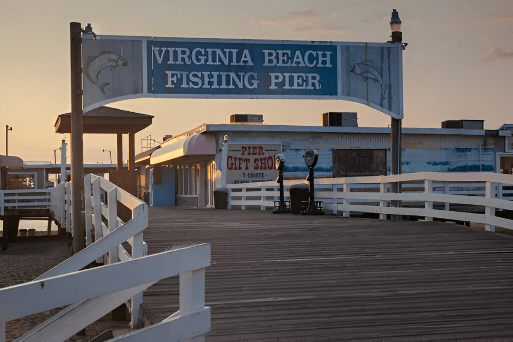 10 Of the Best East Coast Family Vacations and Destinations Family biking along the Virginia Beach boardwalk with the ocean in the background – classic East Coast family beach trip
