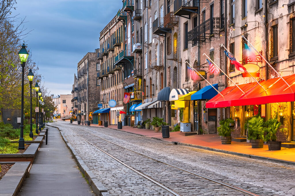 10 Of the Best East Coast Family Vacations and Destinations Historic oak-lined street in Savannah, Georgia with families sightseeing charming East Coast family destination