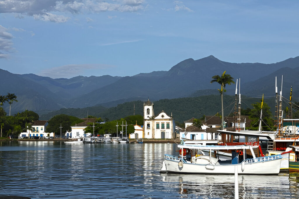 10 Magical Solo Travel Destinations To Fall In Love With The World Again Colonial cobblestone streets in Paraty, Brazil with rainforest backdrop – hidden gem travel destination